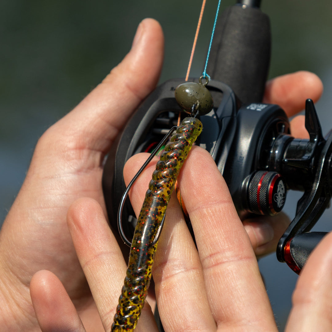 Reaction Tackle Tungsten Football and Swing Jig Heads, 3-pack, showcasing sleek fishing jig heads with detailed hooks and tungsten finish.