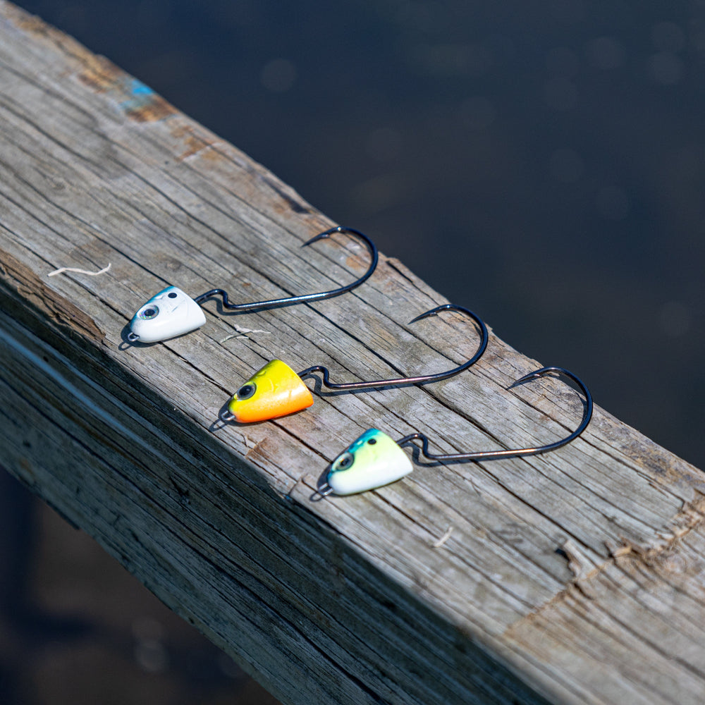 Reaction Tackle tungsten jig heads for swimbaits and swings, featuring a sleek design and sharp hooks for effective fishing.