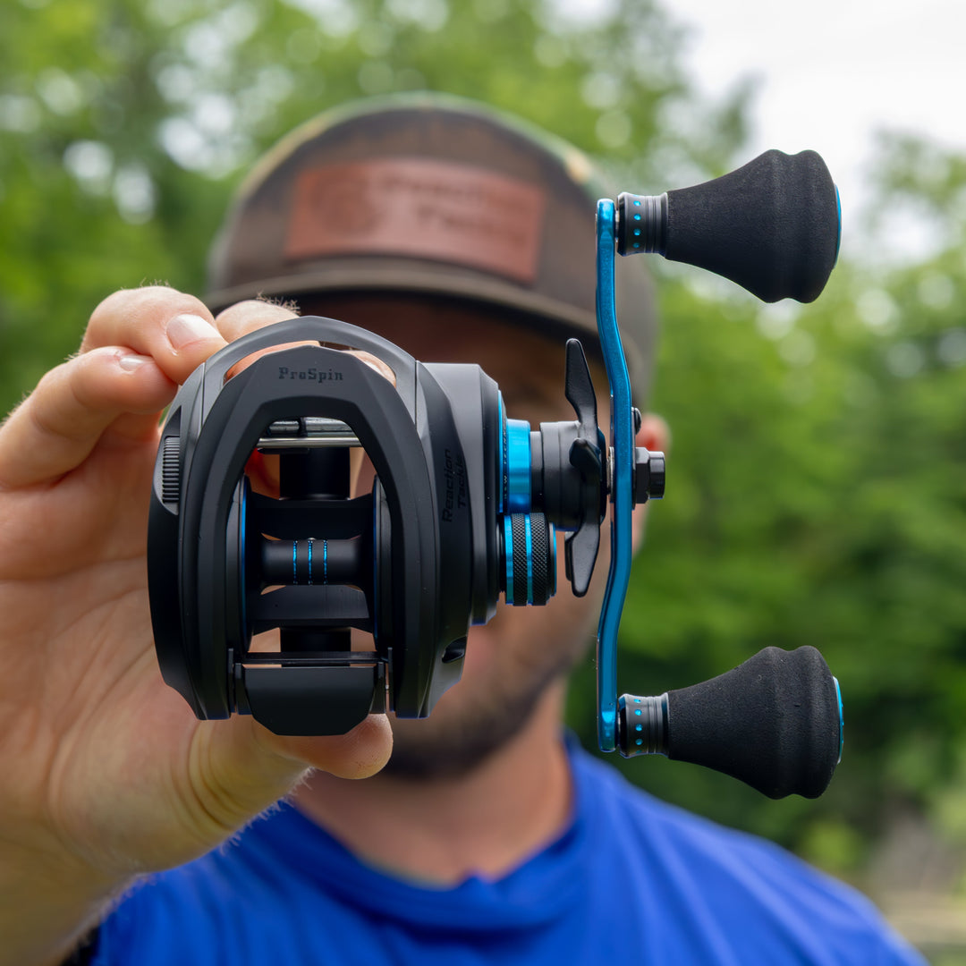 Reaction Tackle ProSpin Baitcasting Fishing Reel with 6.8:1 gear ratio, black and silver finish, close-up view.