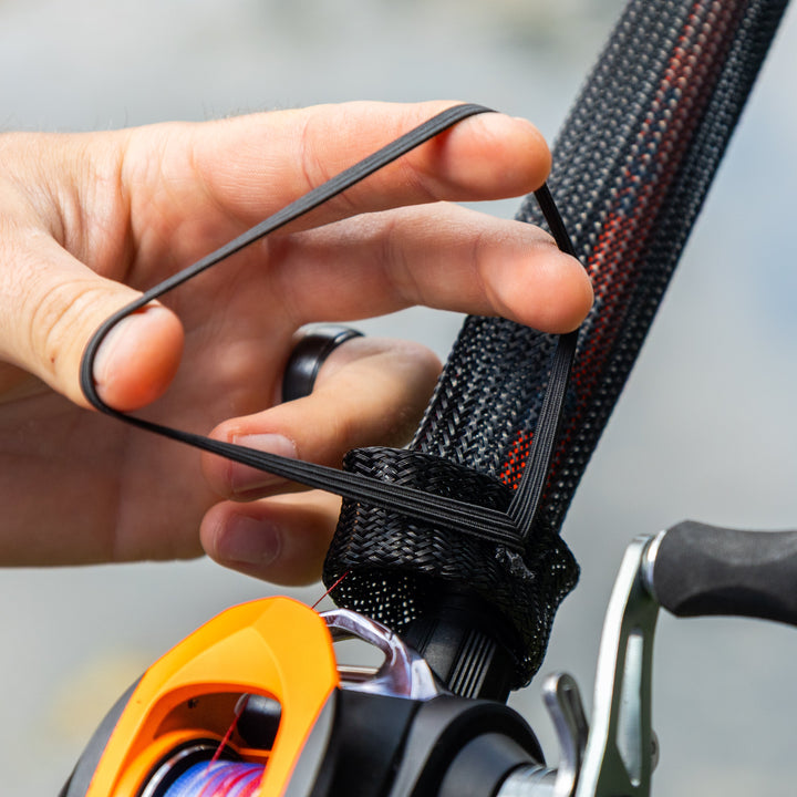 Two black Reaction Tackle fishing rod covers, rod sleeves, or socks for protecting casting rods, shown in a 2-pack.