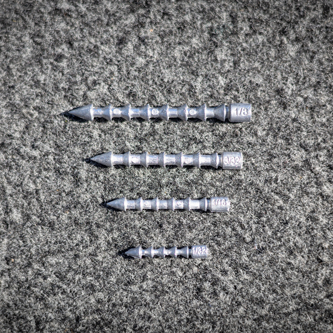 Reaction Tackle tungsten lead nail weights used as insert sinkers for fishing, shown in a close-up image.