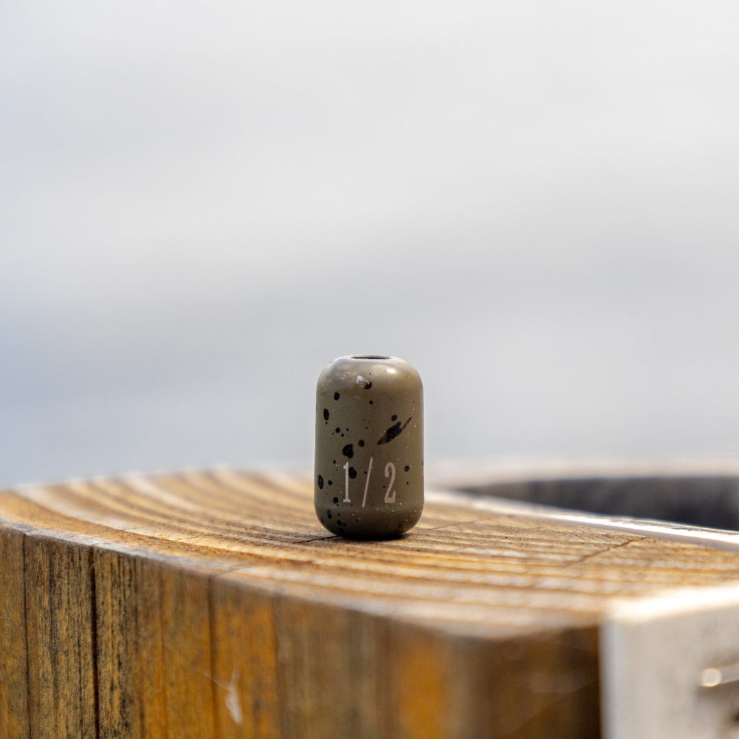 Reaction Tackle tungsten barrel weights in silver, 1/8 oz, set of 8, designed for fishing tackle and weight adjustments.