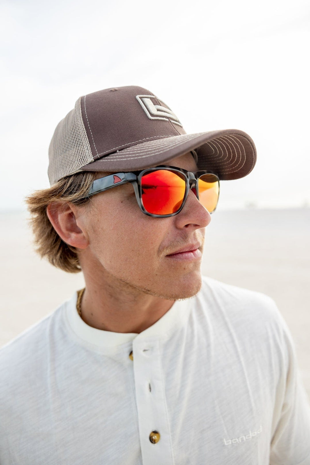 RedFin Polarized Tybee fishing sunglasses with matte honey drift frames and Gulf blue lenses, designed for outdoor fishing activities.