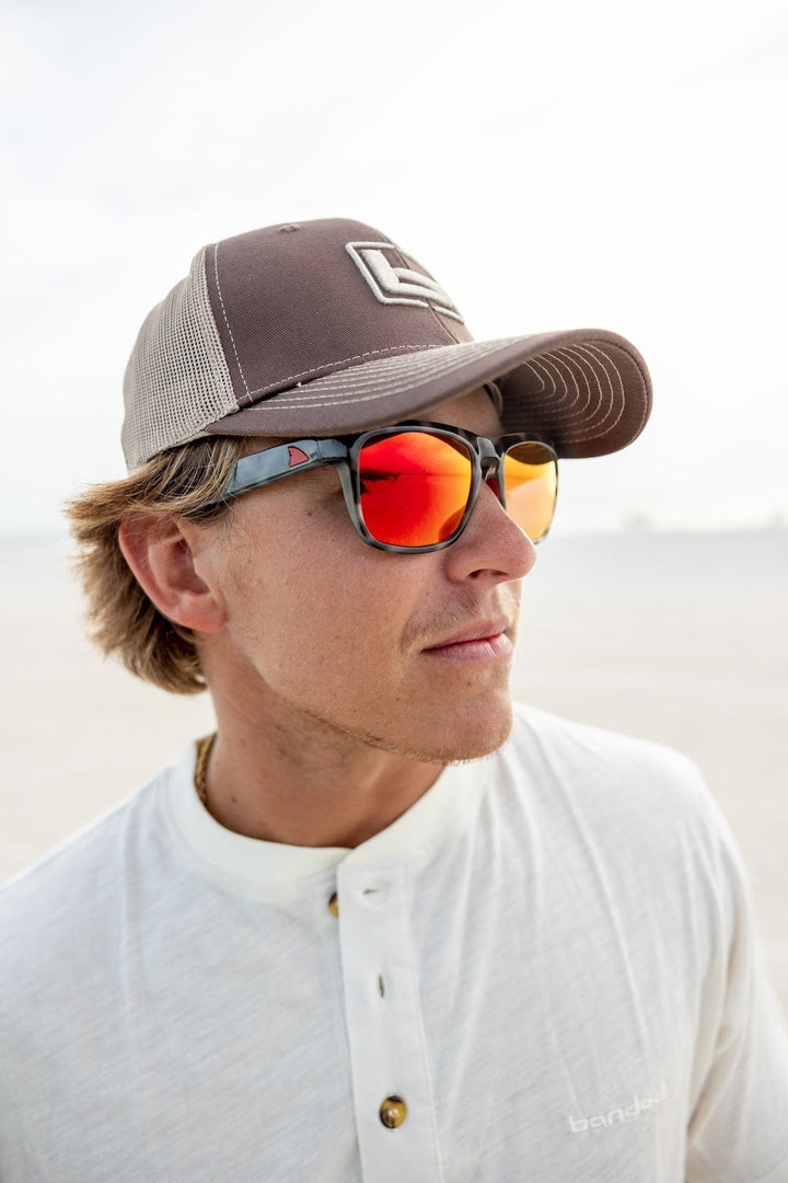RedFin Polarized Tybee fishing sunglasses with matte honey drift frames and Gulf blue lenses, designed for outdoor fishing activities.