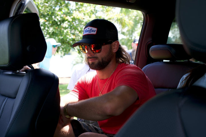 RedFin Polarized Tybee fishing sunglasses with matte honey drift frame and Gulf blue lenses, designed for outdoor fishing activities.