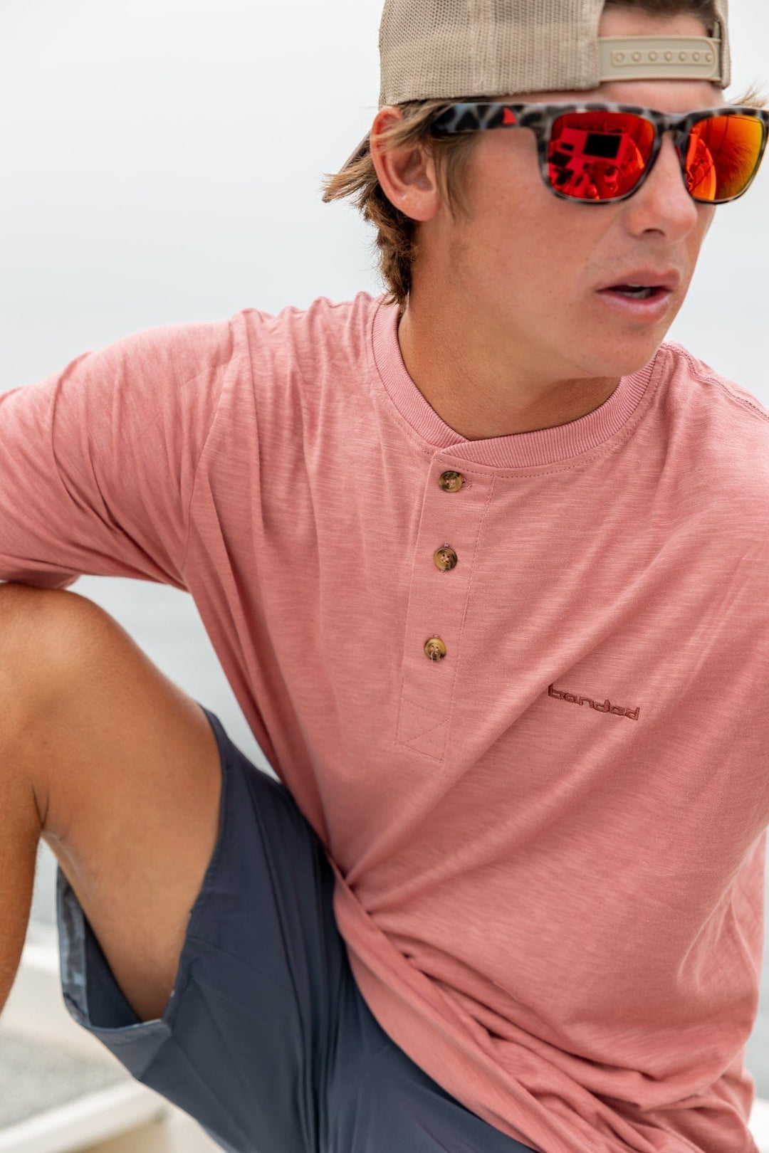 RedFin Polarized Tybee fishing sunglasses with matte honey drift frames and blue lenses, designed for outdoor fishing activities.