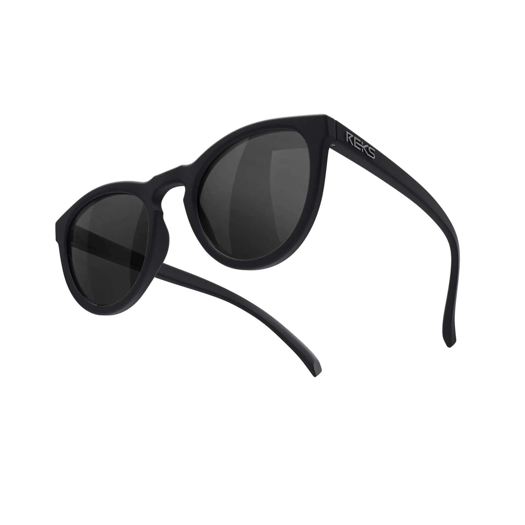 REKS® round polarized polycarbonate sunglasses with rose-amber tinted lenses, stylish and protective eyewear for outdoor wear.