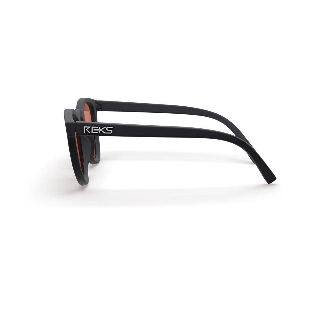 REKS® round polarized polycarbonate sunglasses with rose-amber tinted lenses, stylish and UV-protective for outdoor wear.