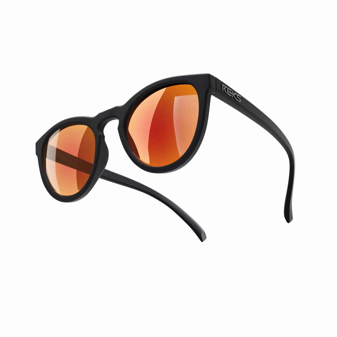 REKS® round polarized polycarbonate sunglasses with rose amber lenses, stylish and protective eyewear for outdoor wear.