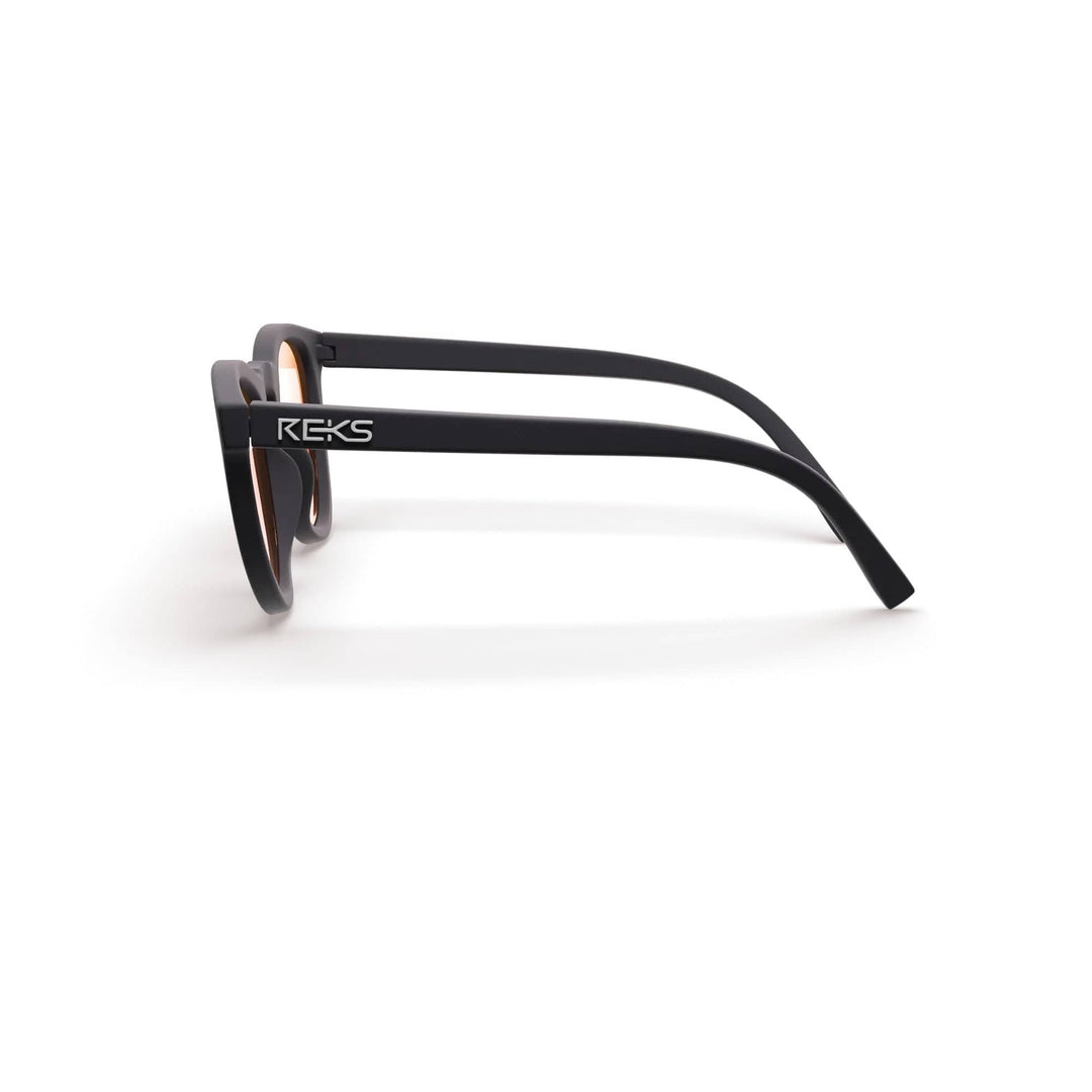 REKS® round polarized sunglasses with rose amber polycarbonate lenses, stylish and protective eyewear for sunny days.
