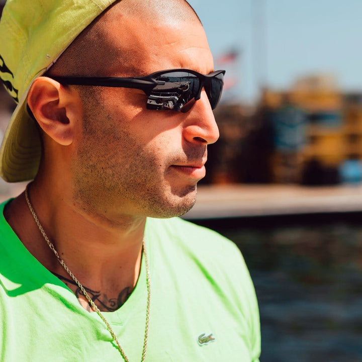REKS® Sling Blade polarized sunglasses with Trivex® lenses in black, showcasing the sleek, lightweight design and durable frame.