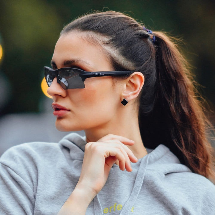 REKS® Sling Blade polarized sunglasses with silver frame and Trivex® lenses, featuring a sleek, modern design.