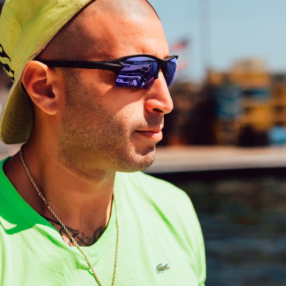 REKS Sling Blade polarized sunglasses with blue frame and Trivex lenses, showcasing a stylish and durable eyewear design.
