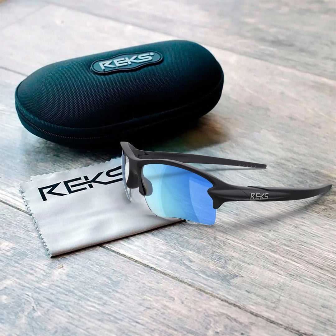 REKS® Sling Blade polarized sunglasses with Trivex® lenses, featuring a sleek black frame and wraparound design.
