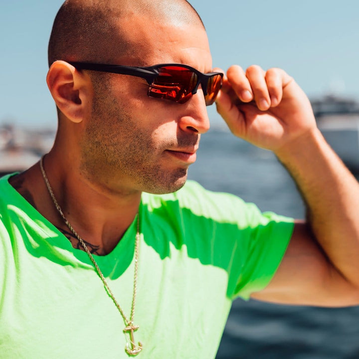 Red Sling Blade polarized sunglasses with mirror lenses from REKS® featuring Trivex® material and sporty design.