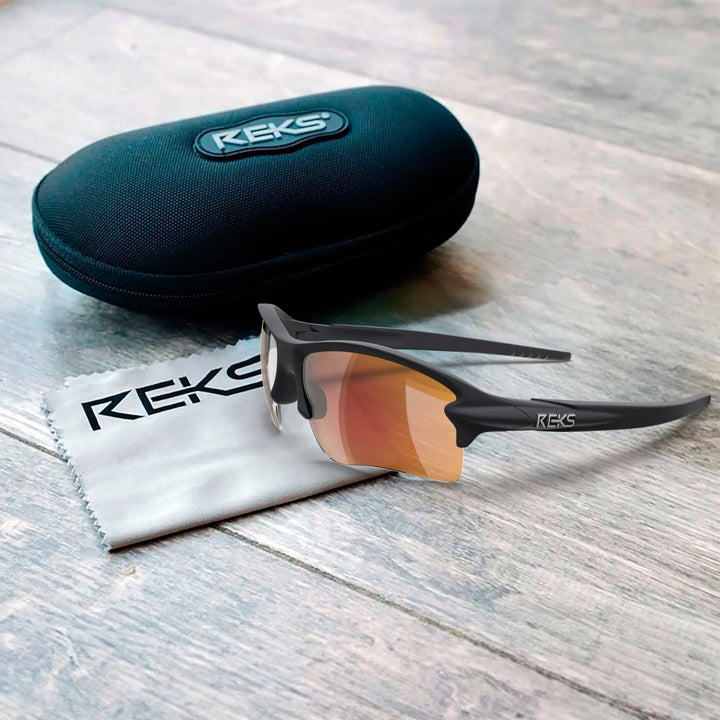 Red REKS® Sling Blade polarized sunglasses with Trivex® lenses, featuring a sleek, sporty design and adjustable nose pads.