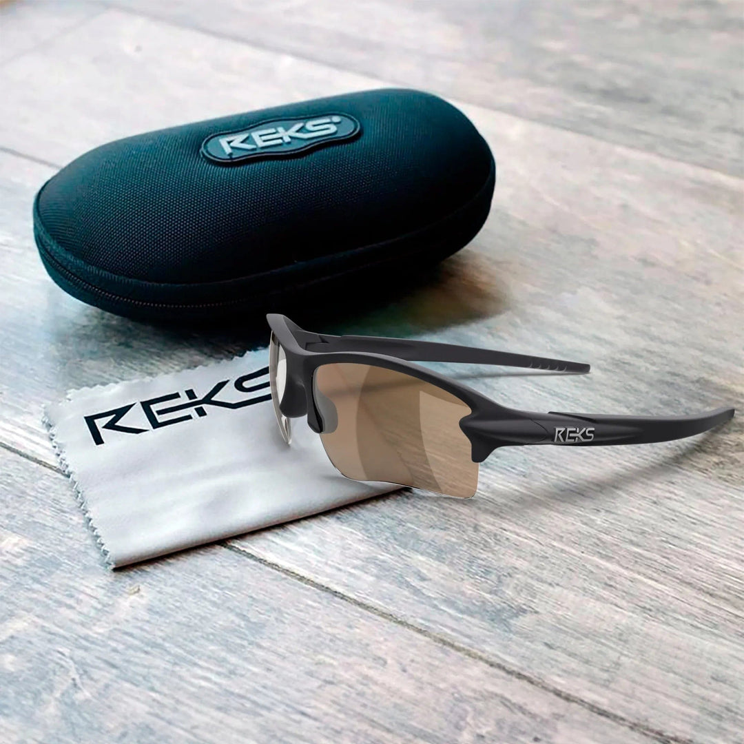 REKS Sling Blade polarized sunglasses with Trivex lenses, black frame, and adjustable nose pads, displayed in a protective case