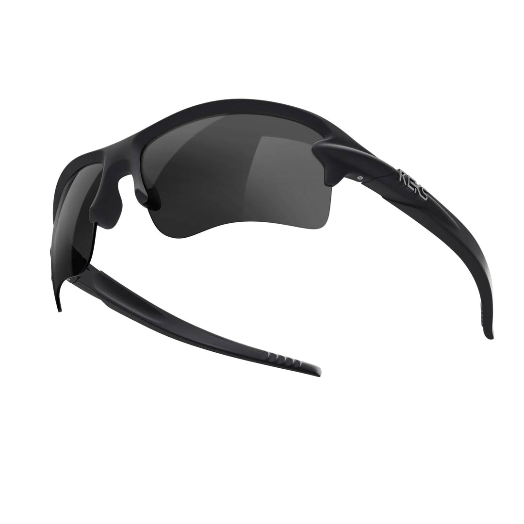 REKS Sling Blade polarized sunglasses in black with smoke tint lenses, showcasing a sleek, modern design with Trivex® lenses.