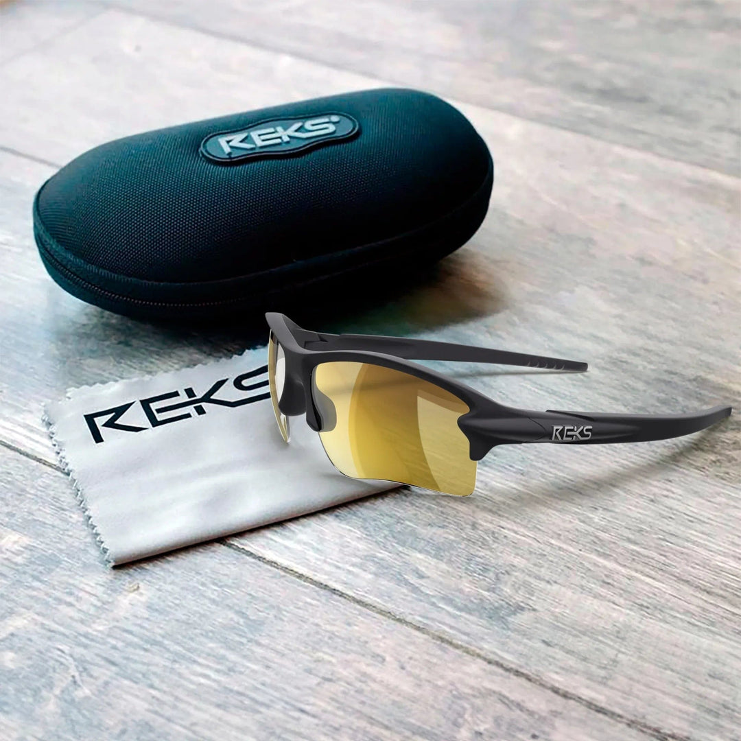 REKS® Sling Blade polarized sunglasses with Trivex® lenses, black frame and sleek design, shown in the case.