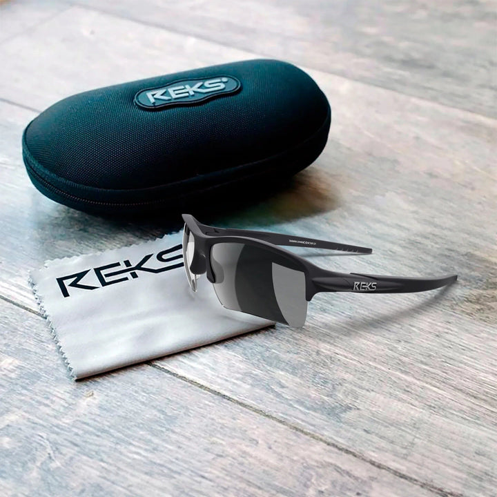 REKS Sling XM polarized sunglasses with Trivex® lenses in a black case, showcasing sleek design and durable frame.