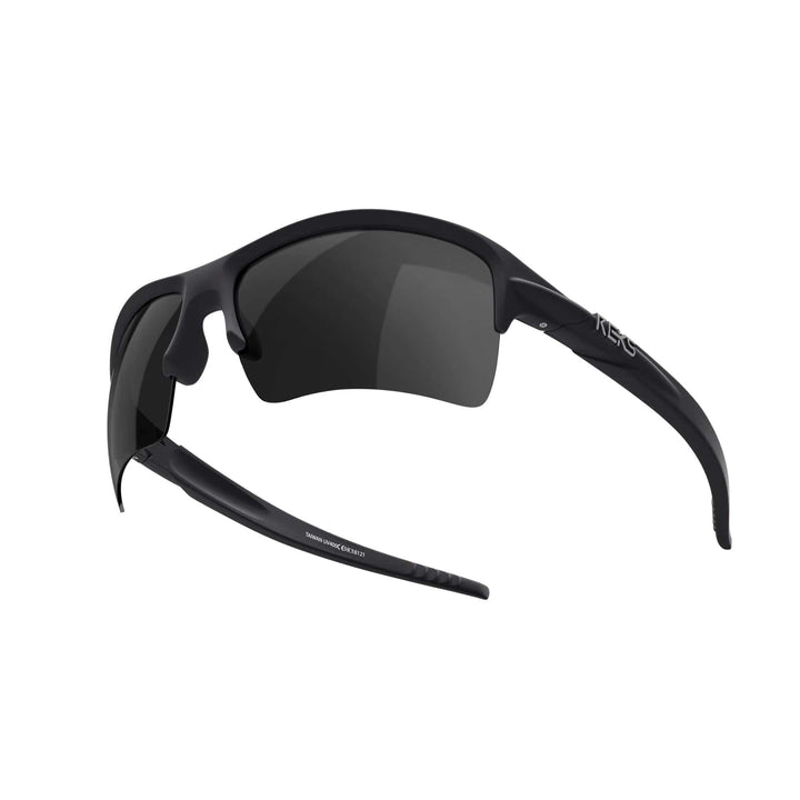 REKS Sling XM polarized sunglasses with smoke tinted lenses, black frame, lightweight design, and Trivex® lenses for clear vision.