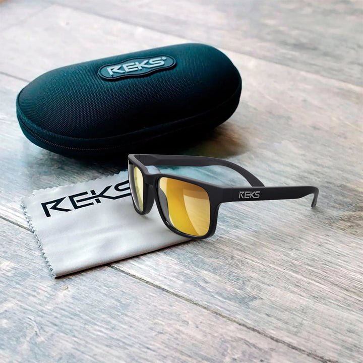 REKS® Sport polarized Trivex® sunglasses with black frame and tinted lenses, designed for outdoor sports and active wear.