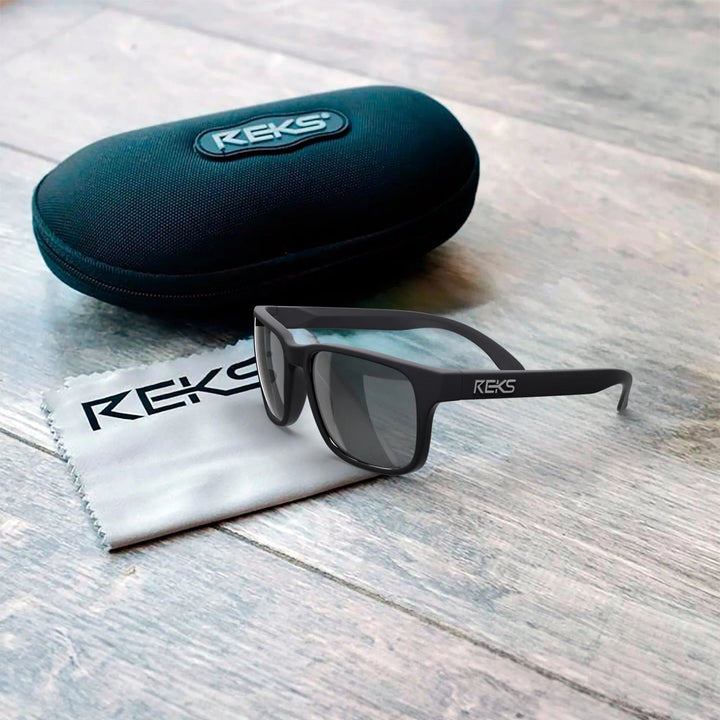 REKS® sport polarized polycarbonate prescription sunglasses with case, featuring sleek design and UV protection.