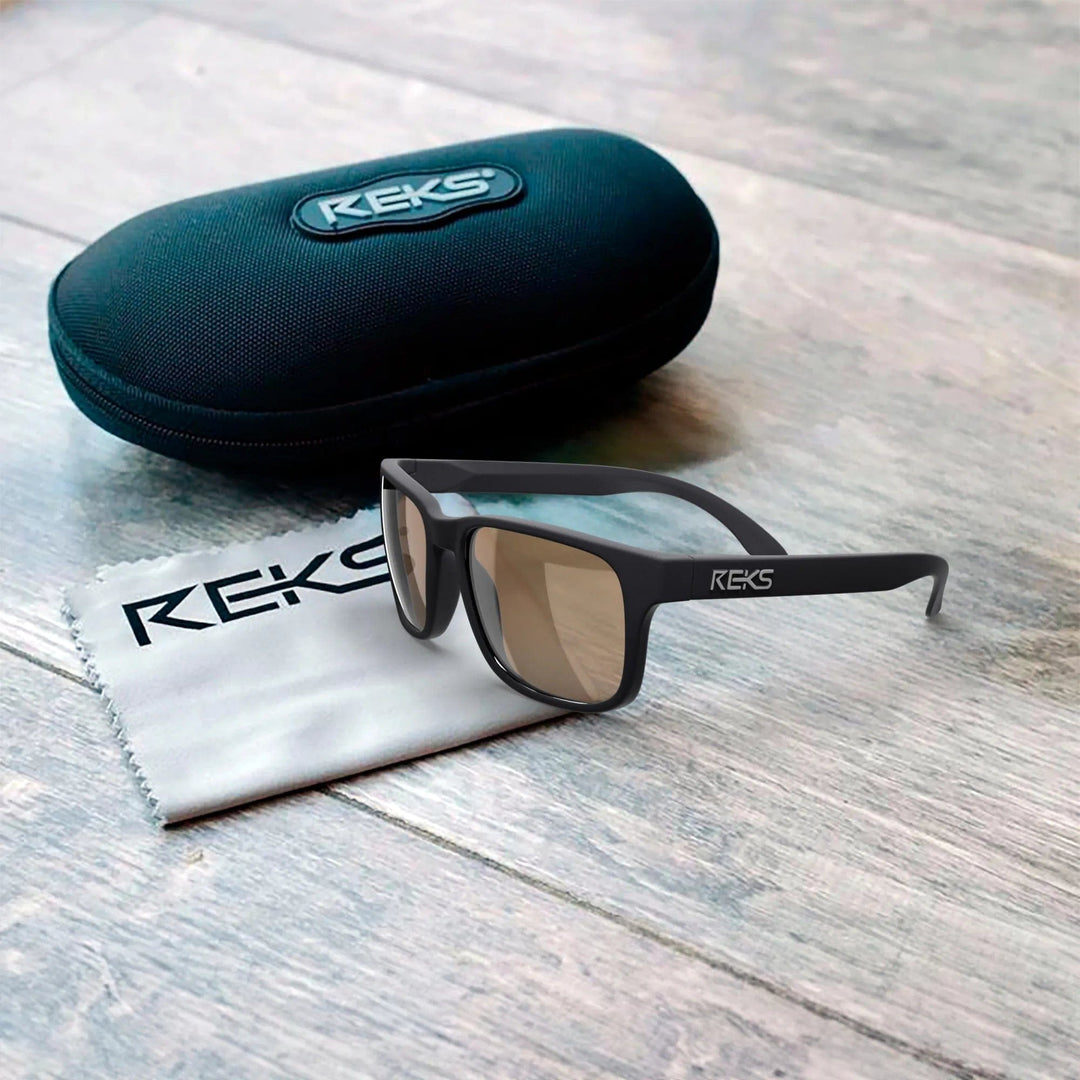 REKS® sport polarized polycarbonate prescription sunglasses with black case, showcasing sleek sports design and durable frames.