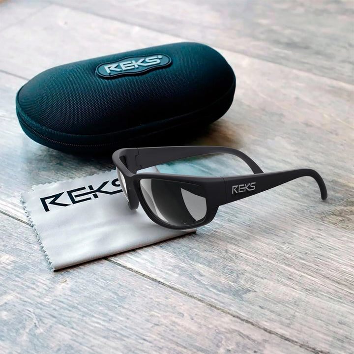 REKS® wrap-around prescription polarized sunglasses with solid smoke lenses, polycarbonate frame, designed for eye protection and style.