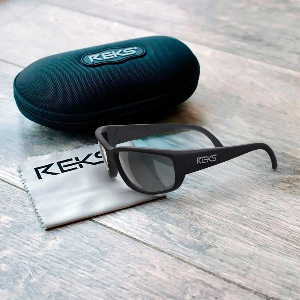 REKS® large wrap prescription polarized polycarbonate sunglasses in a sleek black frame with dark lenses.