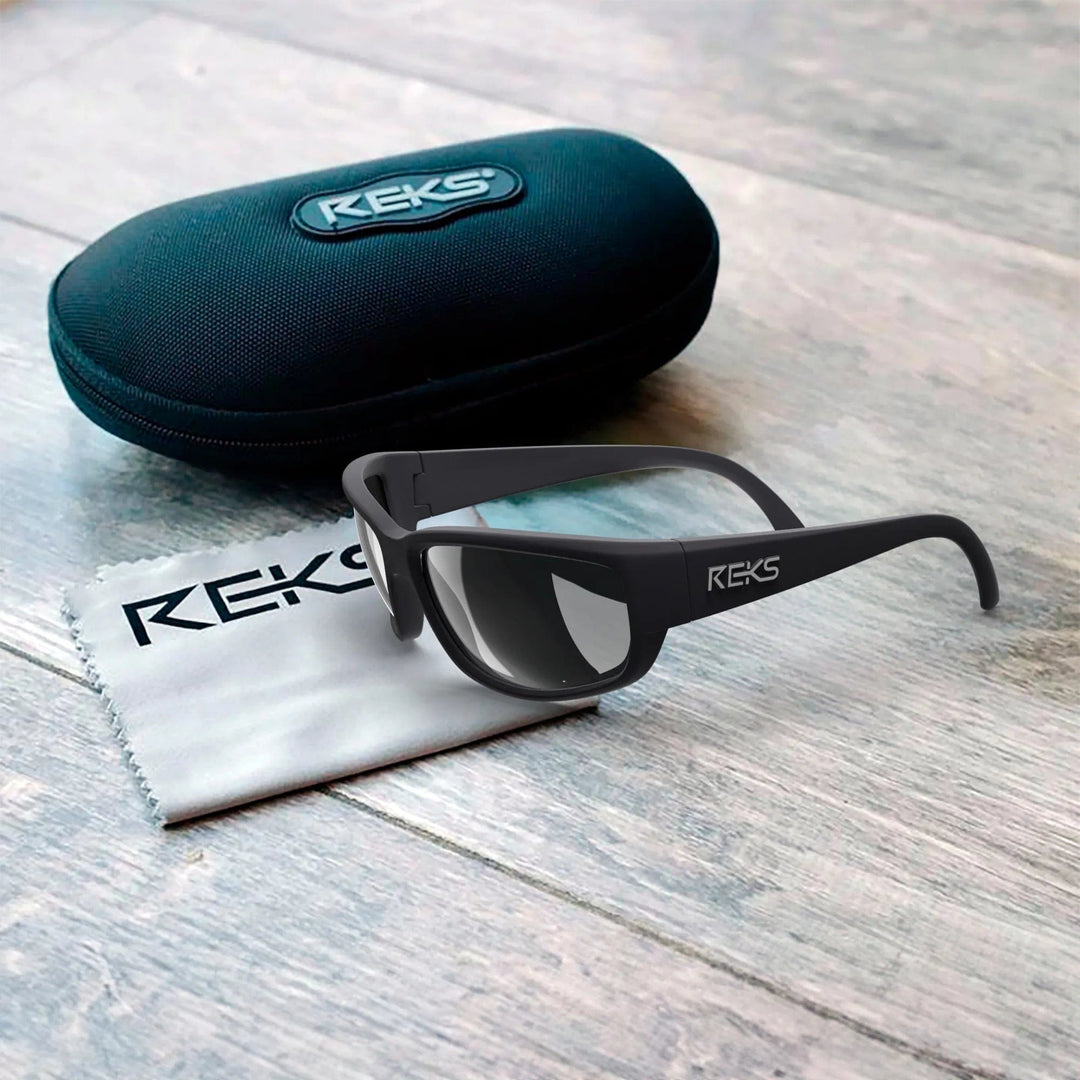 Large wrap prescription polarized sunglasses by REKS® with black polycarbonate frames and sleek design.