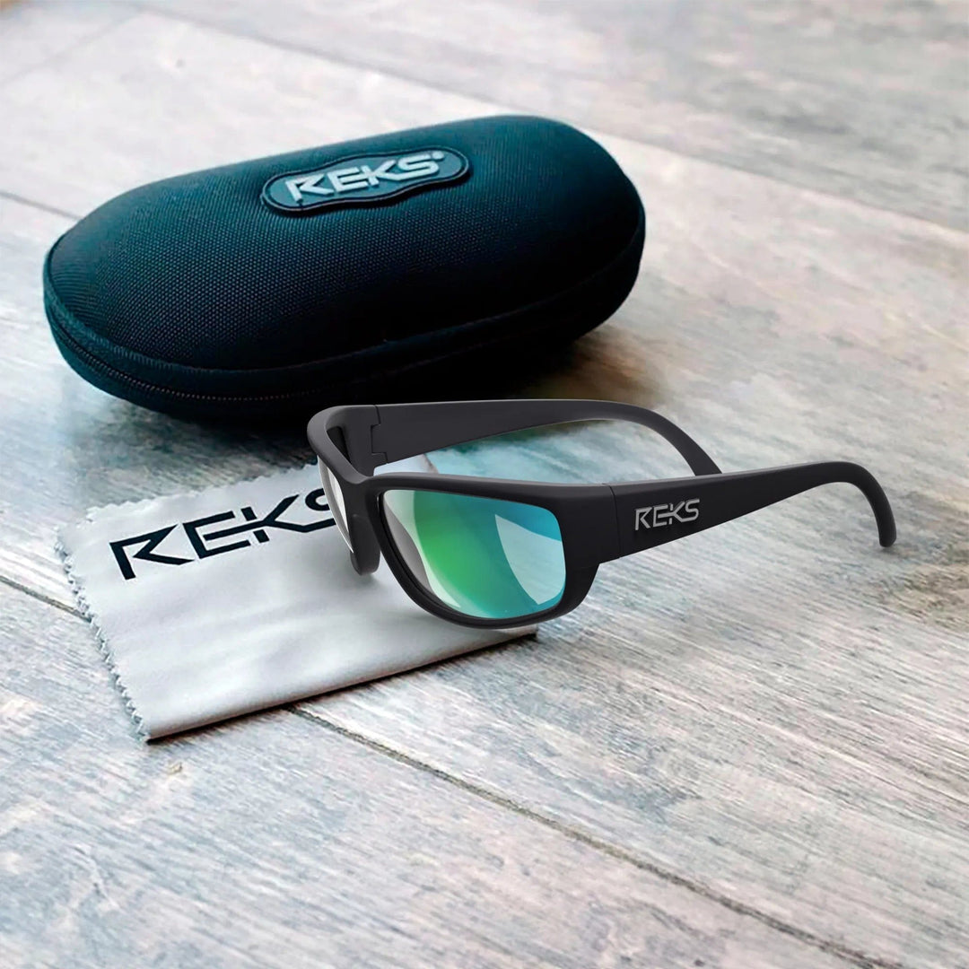 Large REKS® wrap prescription polarized sunglasses with polycarbonate lenses, shown with protective case.