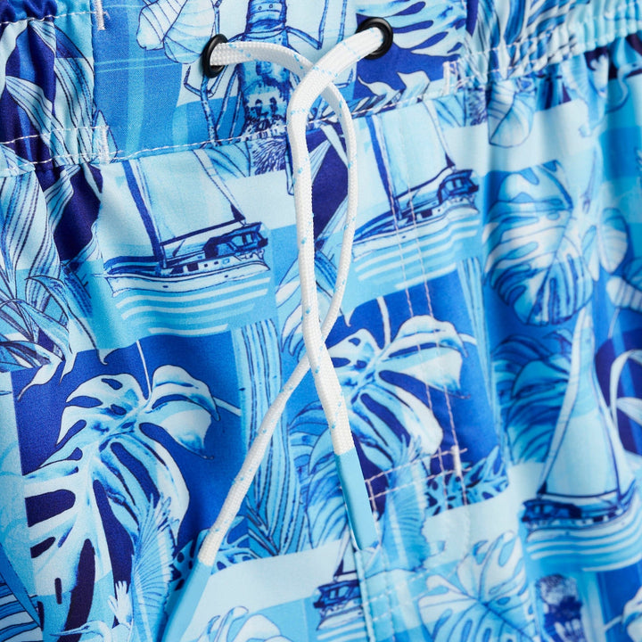 Blue FLA Living Captain Snacks Volleys shorts from Scalesgear.com, featuring a relaxed fit and casual athletic style.