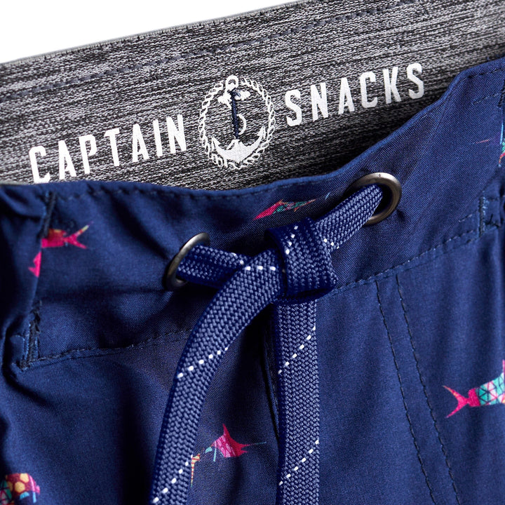 Navy Trippy Fish Captain Snacks Volleys shorts by Scalesgear.com featuring colorful fish pattern on lightweight volley shorts