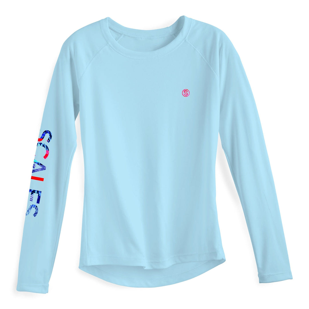 Light blue women's performance long sleeve top by Scalesgear.com from the Epic Trip collection, shown on a white background.