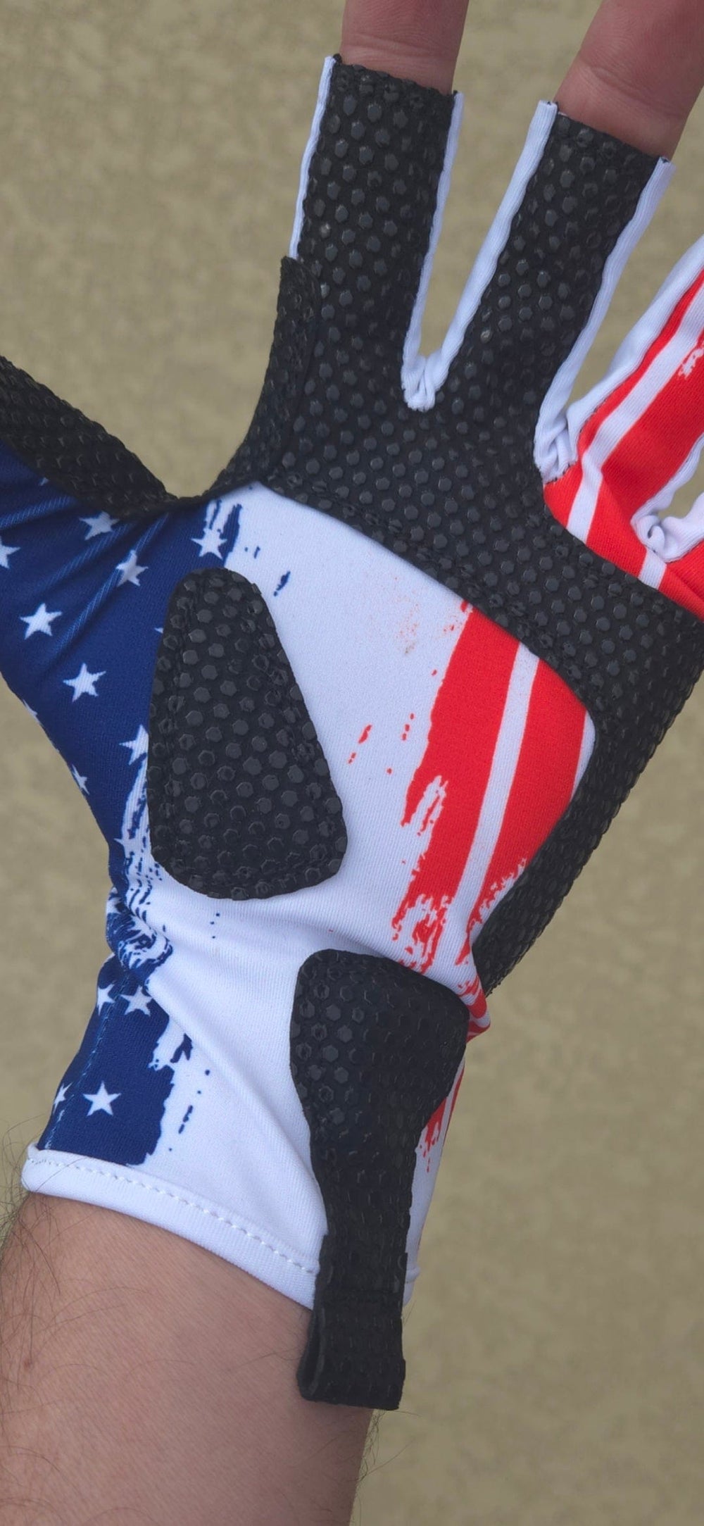 ShredFin Fingerless Fishing Gloves in red, white, and blue showing the breathable fabric and secure fingerless design.