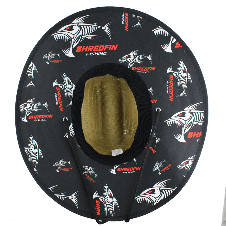 ShredFin El Lago straw hat showing the underside with woven straw pattern and wide brim for sun protection.
