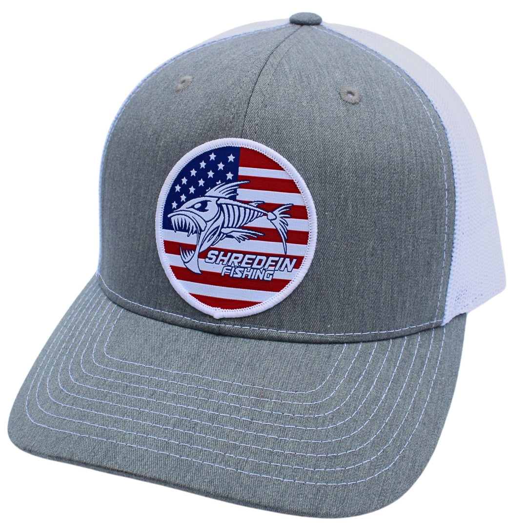 ShredFin Freedom Patch Hat, a stylish casual cap with a stitched patch design, featuring a curved brim and adjustable strap.