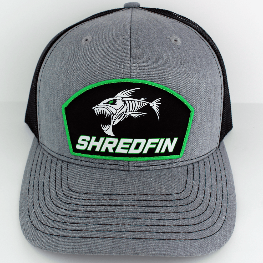 ShredFin Heather gray and black patch hat with neon green border, featuring a curved brim and adjustable strap in front.