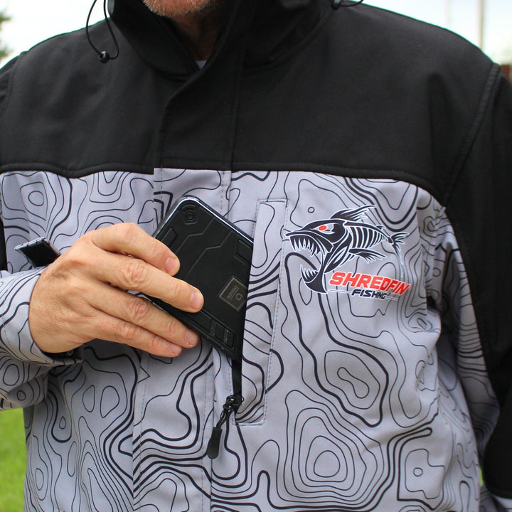 ShredFin Storm Shredder all-weather jacket with contourz pattern, shown in a sleek, weather-resistant design for outdoor wear.