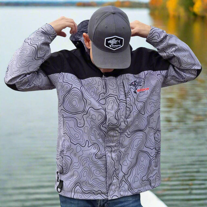 ShredFin Storm Shredder All Weather Jacket with Contourz pattern, waterproof and breathable outdoor windbreaker for active wear.