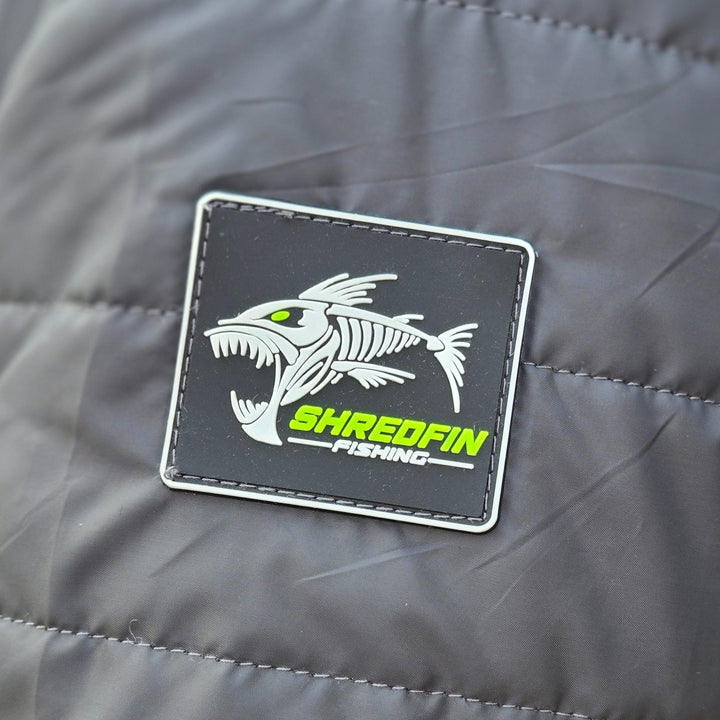 Gray ShredFin Tailwindz hooded jacket with front zipper and adjustable drawstrings, shown on a mannequin.