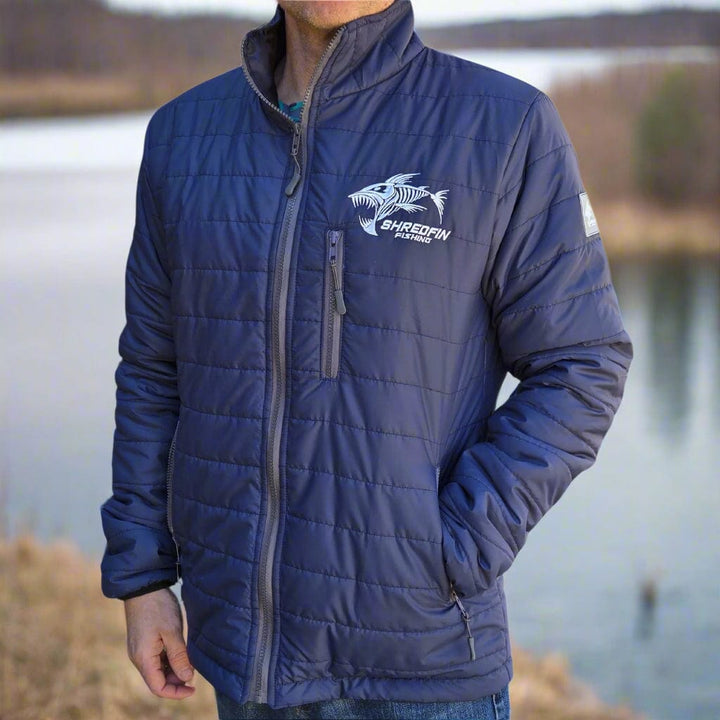 ShredFin Tailwindz Navy Blue Jacket displayed flat, showing its lightweight, water-resistant fabric and stylish hood design.