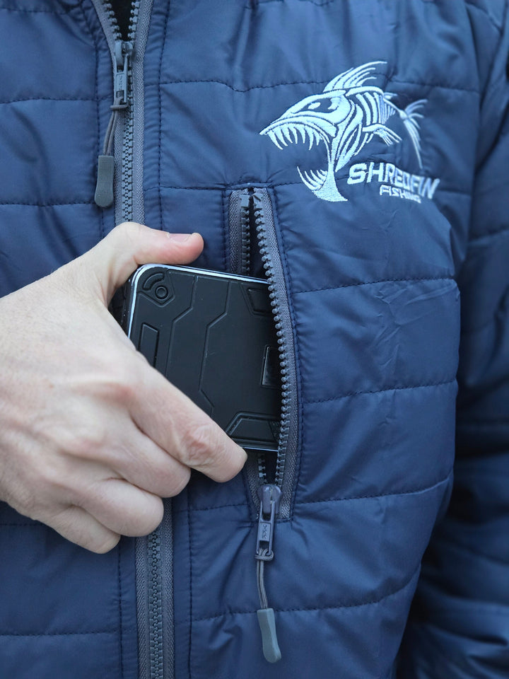 ShredFin Tailwindz jacket in navy blue with a sleek design, featuring a high collar and zippered pockets, suitable for outdoor wear.