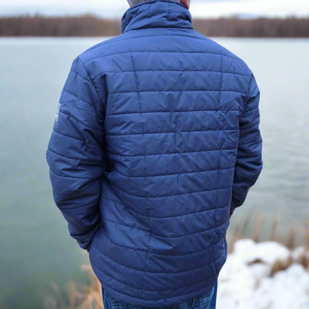 Navy blue ShredFin Tailwindz jacket displayed on a hanger, showcasing its stylish design and lightweight fabric.