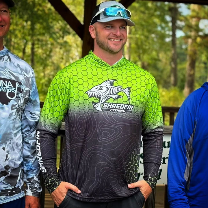 ShredFin Contourz HexCast hooded performance shirt in chartreuse and black fade, featuring a fitted athletic design.