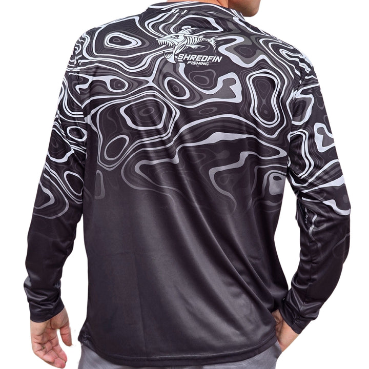 ShredFin Contourz Performance Shirt in Platinum River Fade featuring a sleek, fitted design and vibrant color pattern.