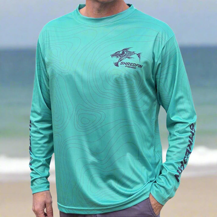 ShredFin Contourz Performance Shirt in seafoam color, made of lightweight, breathable fabric with a fitted design.