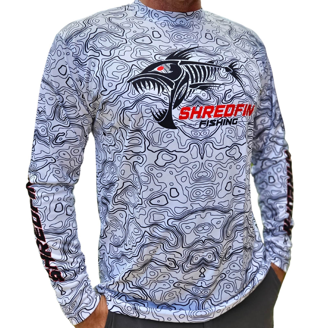 ShredFin Contourz Performance Shirt in white and black, lightweight athletic shirt with fitted design and moisture-wicking fabric.