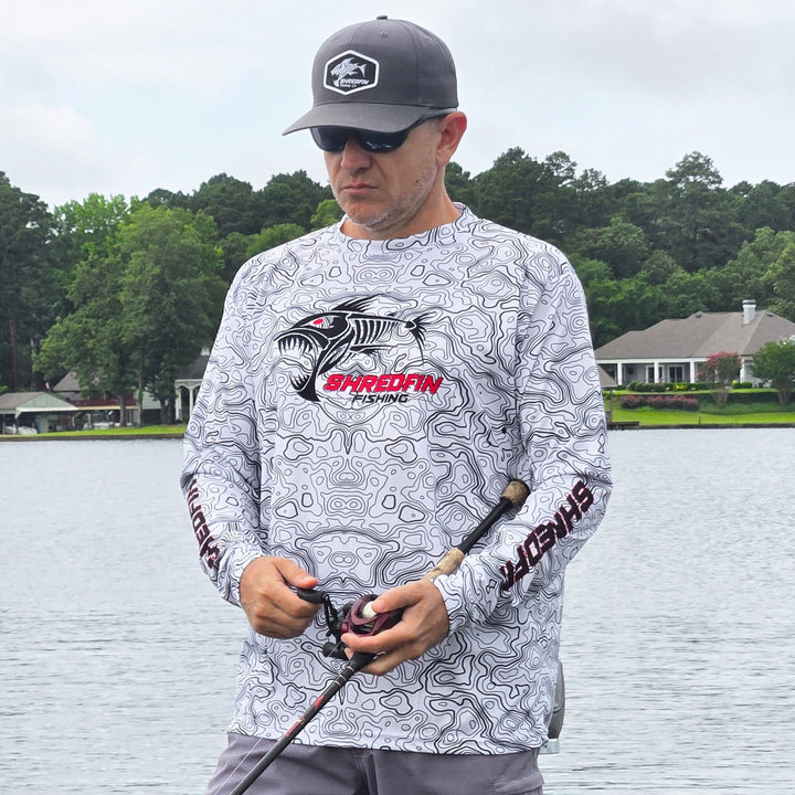 ShredFin Contourz Performance Shirt in white and black, lightweight athletic shirt with sleek design and moisture-wicking fabric.